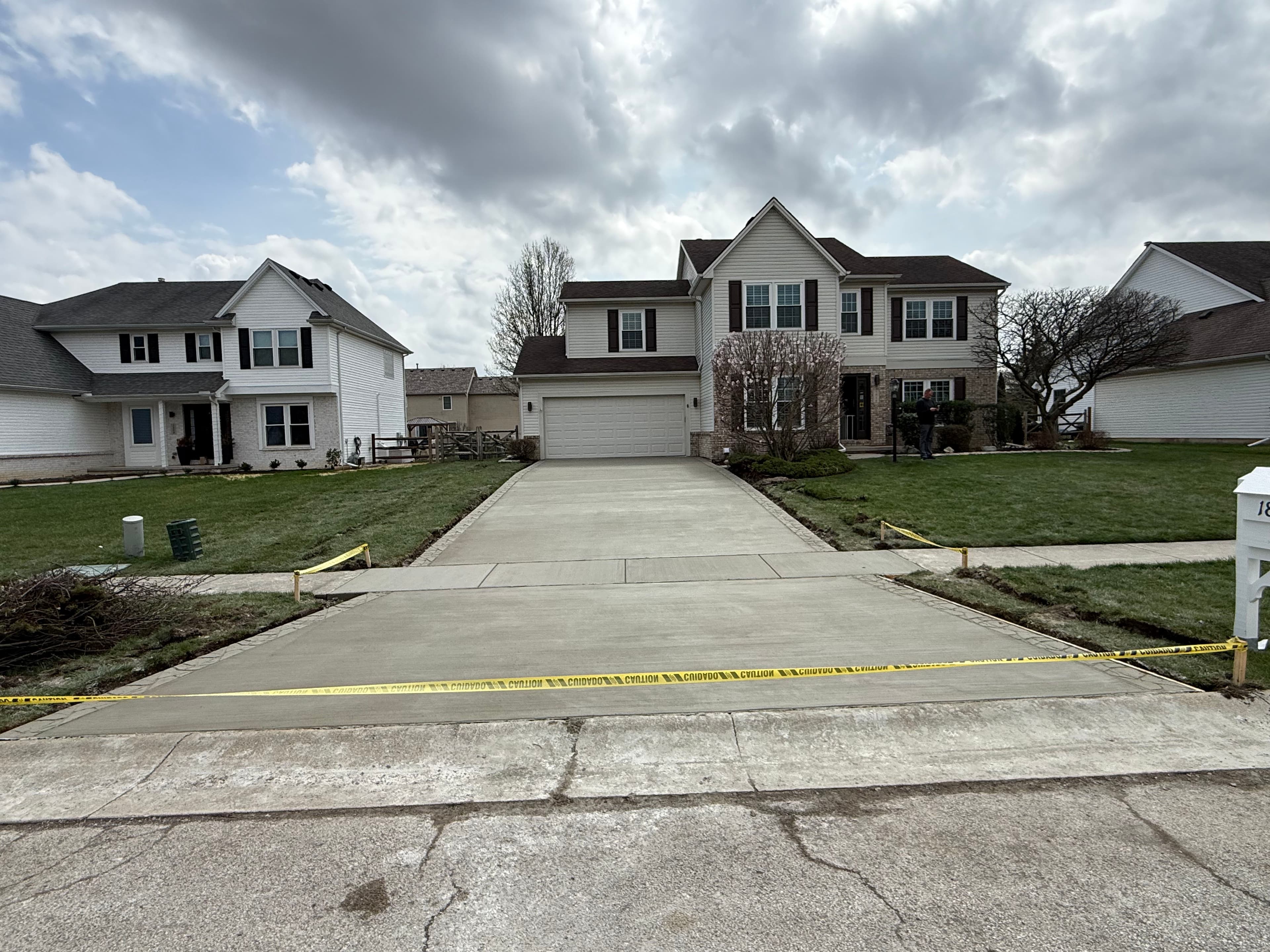 Project Fresh Concrete Driveway with a Stamped Border That Actually Pops image