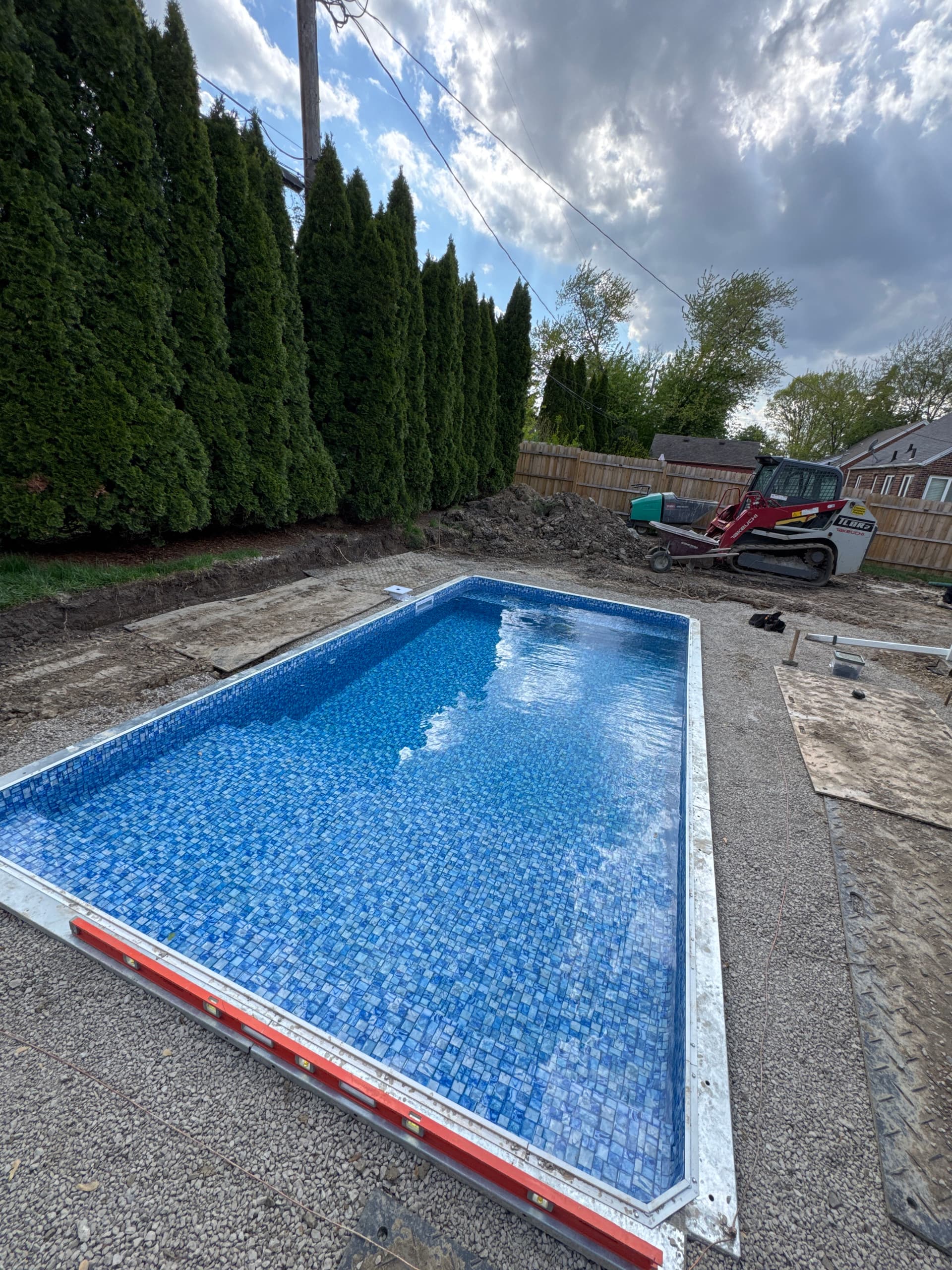 Inground Vinyl Liner Pool Installation With the Rain on the Way image